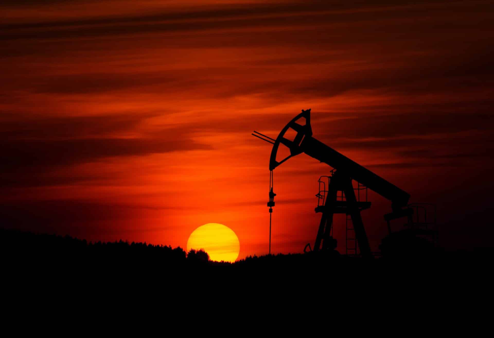 Photo of Pumpjack with red sunset in the background