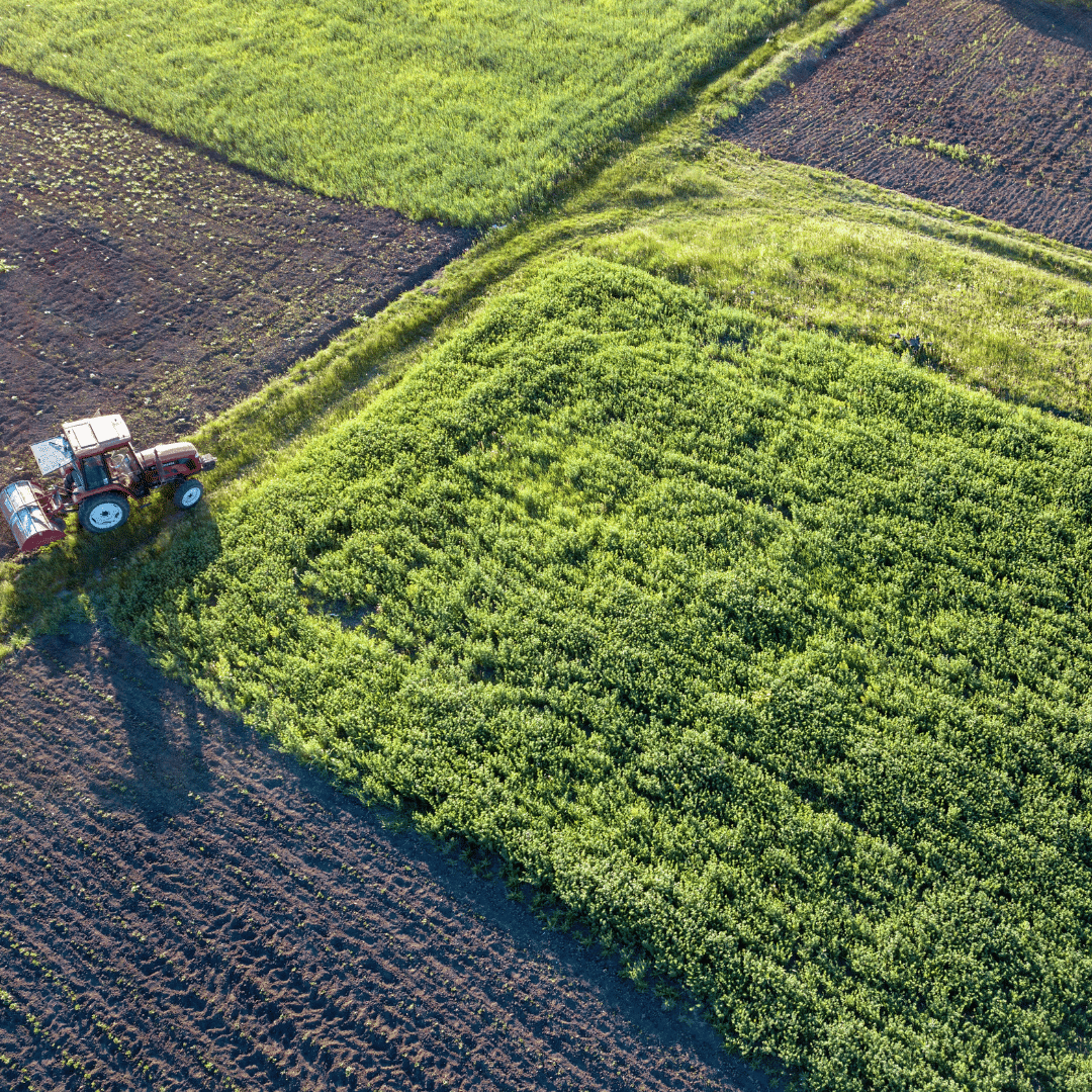 aerial image of a field with a tractor in the corner